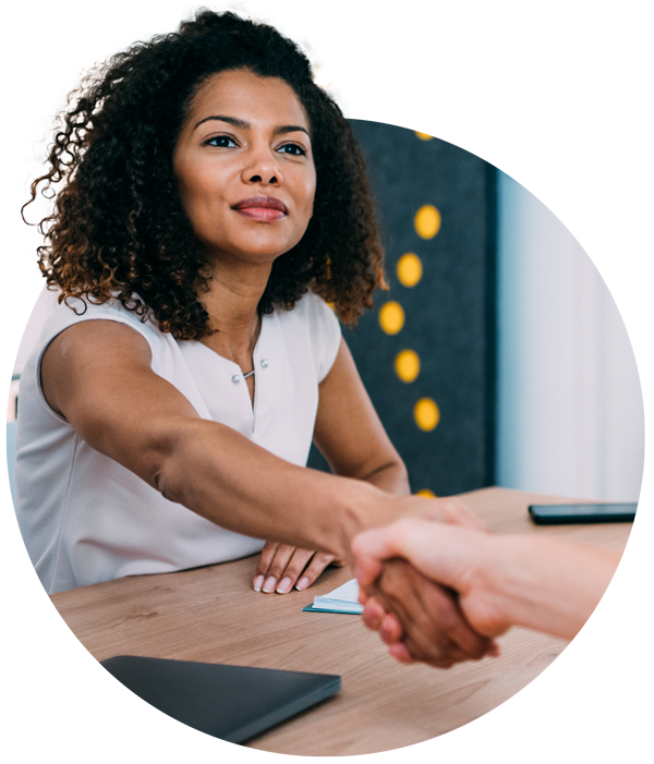 Photo of two women shaking hands