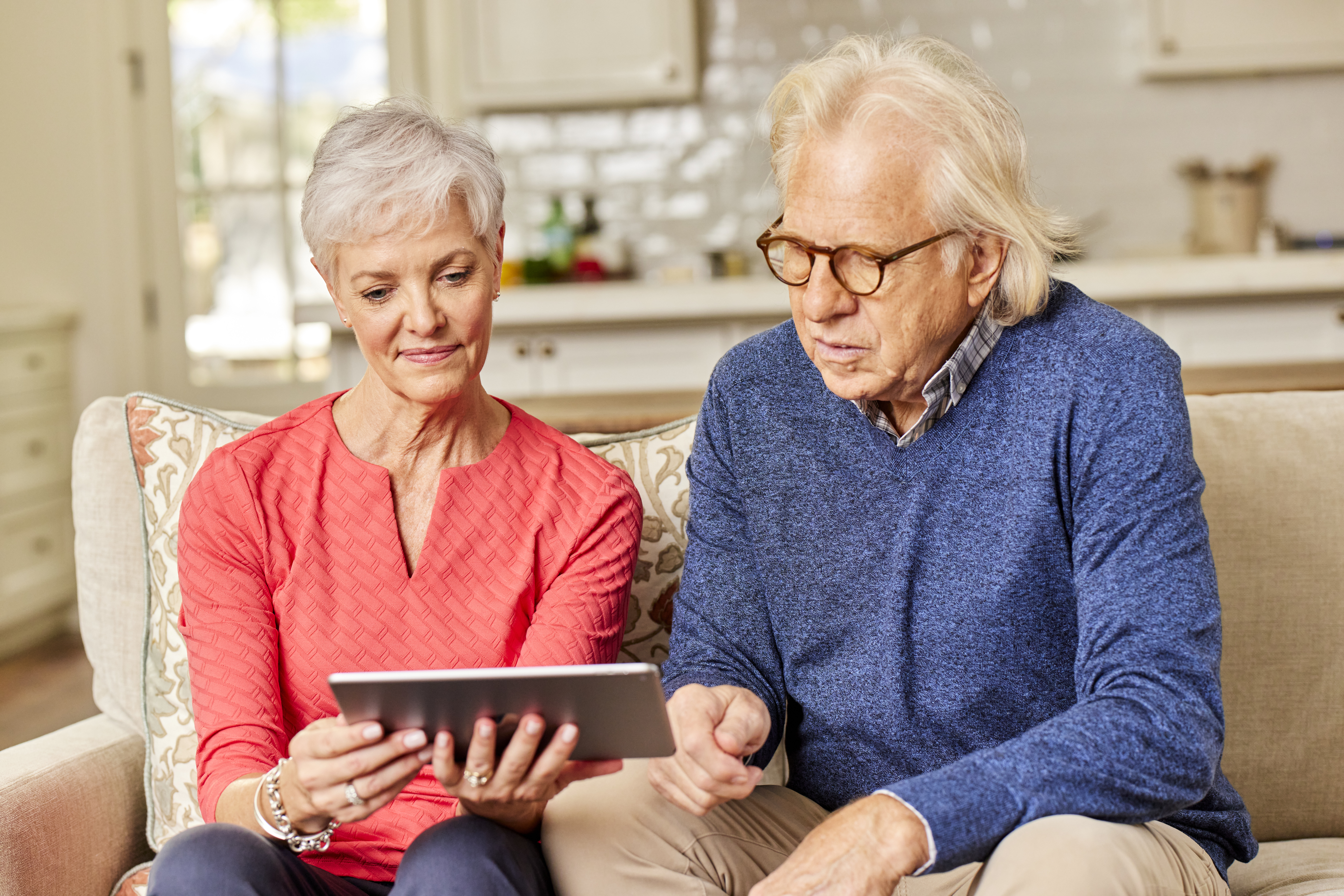 Couple looking at tablet