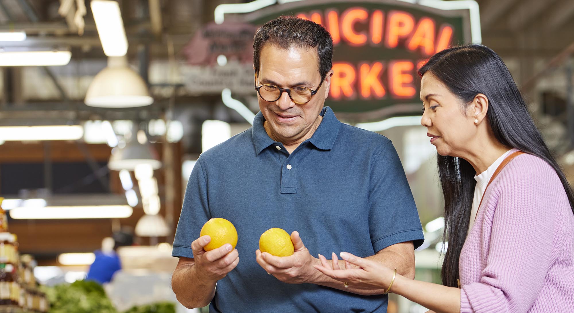 Couple shopping for produce.